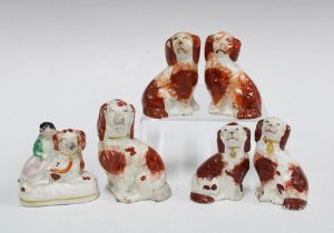 A group of small 19th century Staffordshire spaniels, tallest 9cm (6)