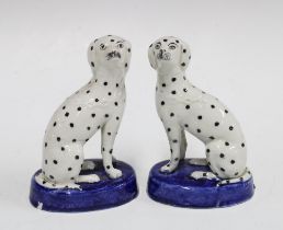 Small pair of 19th century Staffordshire Dalmatians on oval blue bases, 12cm (2)