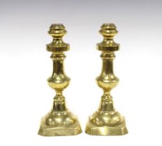 Pair of heavy brass candlesticks, each with a knop stem and square canted base, 27cm (2)