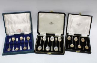 Two cased sets of six silver teaspoons together with a cased set of six silver and shell