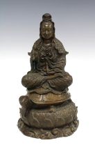 Bronze patinated resin figure of a Buddha, modelled seated on a turtle and lotus base, 31cm