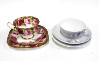 A Royal Albert bone china cup, saucer and side plate trio together with a Royal copenhagen porcelain
