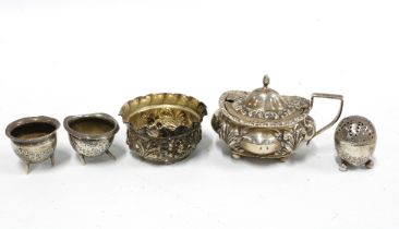 A pair of miniature silver cauldron pots, silver condiments to include a pepper pot, salt and