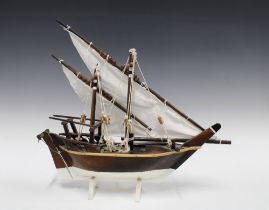 Small model boat with twin masts, 41 x 44cm