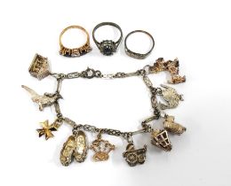 Vintage silver charm bracelet with silver charms and a 9ct gold bagpipe charm and a Maltese gold