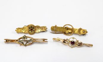 A group of early 20th century gold brooches to include two 15ct brooches and two 9ct gold