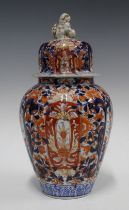 A large Imari vase and cover of lobed form, the cover with a shishi finial, 34cm