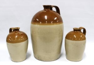 19th century Buchan stoneware pottery whisky flagons inscribed Balbirnie, 32 x 50cm. (3)