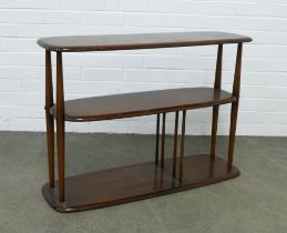 An Ercol dark elm and beech Baby Giraffe three tier trolley - model 361, with integrated magazine