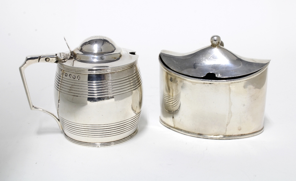 George III silver mustard, navette form with blue glass liner, London 1795 and a barrel form