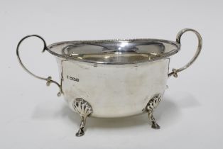 George V silver twin handled bowl, standing on four hoof feet, Sheffield 1930, 20cm long