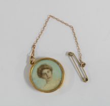 15ct gold framed portrait miniature, in a double sided circular glazed frame, 2.5cm