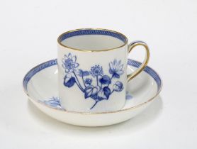 18th century blue and white coffee can and saucer with botanical patterns and a Wedgwood style