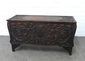 Manner of Alexander Ritchie, an early 20th century oak carved coffer, with celtic dragon pattern, 84