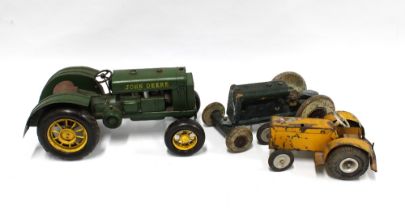 John Deere tinplate tractor and two others (3) .