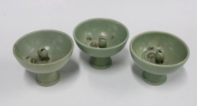 Three Chinese celadon glazed serpent stem cups, (3) 13 x 9.5cm.