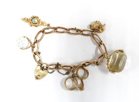 9ct gold charm bracelet with five charms and a heart shaped padlock