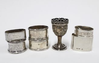 Victorian silver egg cup, London 1895 and a collection of six silver napkin rings with various