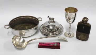 A box containing Victorian and later Epns wares to include a ladle, goblet, hip flask, etc