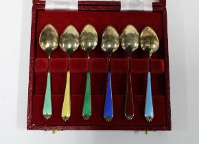 A harlequin cased set of six silver gilt and enamel coffee spoons, Birmingham 1958 (6)
