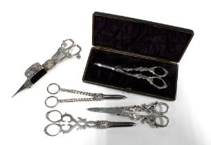 A collection of Epns grape scissors and candle snuffers (5)