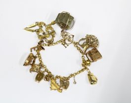 9ct gold charm bracelet with a collection of charms mostly stamped 375