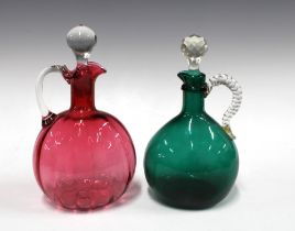 Cranberry glass decanter and stopper and a green glass decanter with stopper (2) 14 x 24cm.