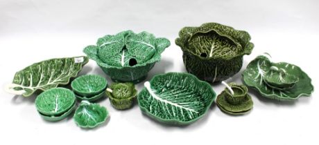 A collection of green-glazed cabbage leaf pottery, to include a tureens and serving dishes, (15)