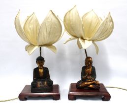 A pair of chinoiserie wooden base table lamps with detachable giltwood painted figures, lotus flower
