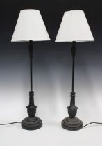 A pair of black thin stemmed table lamps with shades (2) 14 x 61cm.