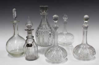 A pair of cut glass globe and shaft decanters with stoppers and four others and one Hollands
