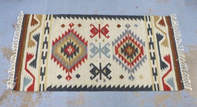 A flatweave Kelim type rug with geometric motifs, 60 x 130cm approx
