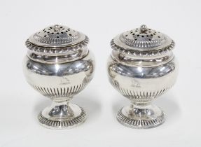 A pair of George III silver bun casters, London 1798, 8cm (2)