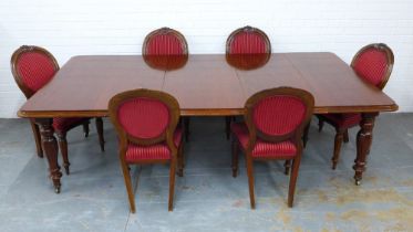 Mahogany extending dining table, (with two extra leaves) on facet baluster legs, together with a set
