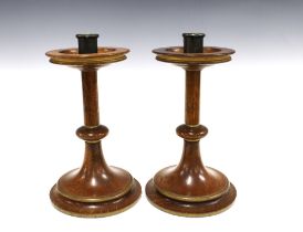 A pair of Arts & Crafts oak knop stem candlesticks, on a spreading circular footrim base (2) 17 x