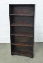 Whytock & Reid style dark oak bookcase with floral carved border and ogee feet, 55 x 122 x 15cm