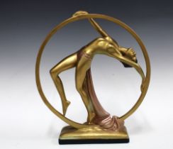 Art Deco dancing girl with hoop, gilt metal and plaster base, 32 x 38cm.