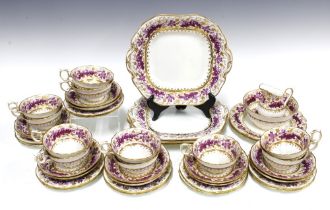 19th century teaset decorated with borders of trailing vines in magenta with gilt highlights,