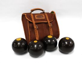 Set of four Lignum Vitae bowls, in a bowling bag