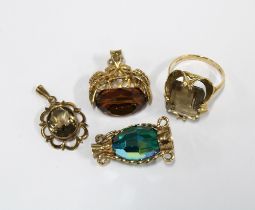 9ct gold smoky quartz dress ring, 9ct gold pendant and two 9ct gold mounted charms (4)