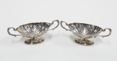 A pair of Edwardian silver salts, twin handled on pedestal bases, Birmingham 1907 (2)