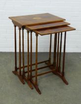 Mahogany and satinwood nest of three tables, with inlaid paterae and faux bamboo legs, 57 x 74 x