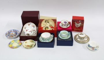 A collection of miniature bone china and porcelain cups and saucers (a lot)