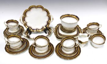 English porcelain teaset with blue rim and gilt borders, retailed by J. Ford & Co, Edinburgh