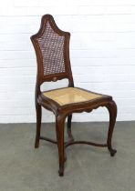 Fruitwood chair, arched high back with cane work and a mother of pearl inlaid floral basket motif
