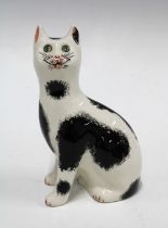 Griselda Hill Pottery Wemyss black and white cat, with painters initials RR, 11 x 17cm.