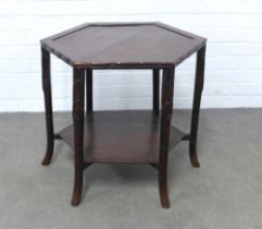 Chinoiserie table with a hexagonal top and raised on faux bamboo legs, with undertier, 56 x 57cm.
