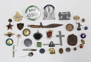 A collection of badges and lapel pins, bus Conductors badges, a silver bloodstone revolving fob,
