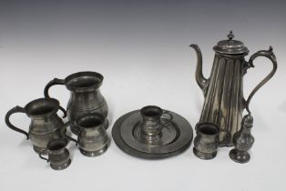 Collection of antique pewter wares to include a coffee pot, tankards, measures, plates and pepper