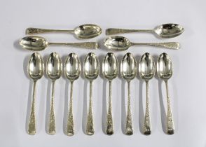 An Edwardian set of twelve silver teaspoons, bright cut engraved, London 1904 (12)